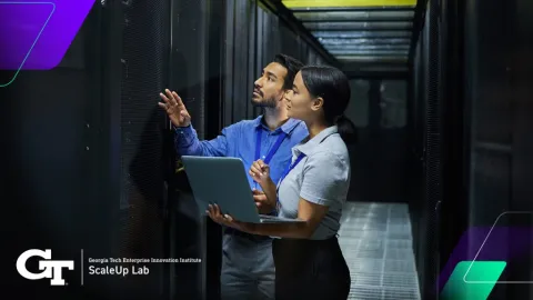 man and women in server room